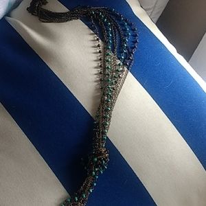 Knotted brass, turquoise, and wooden bead necklace